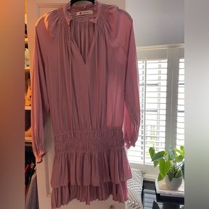 Pink drop waist mini dress with silky, airy material and long sleeves